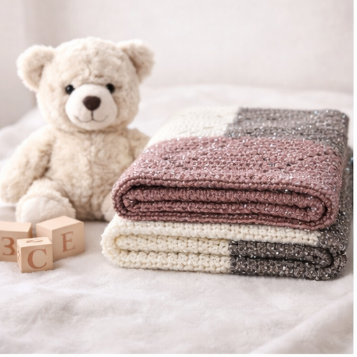 Handmade crochet baby blanket with silver sparkle yarn in soft neutral tones by Collective by Christena